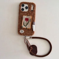Embossed tulip embroidery on TRLab Shop phone case, showing intricate floral design and protective case structure.