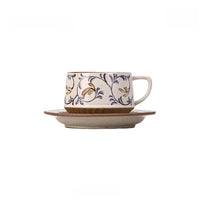 Ceramic coffee cup and saucer set with retro floral pattern, handcrafted by TRLab Shop, featuring vibrant colorful floral design.