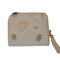Natural shell velour bag by TRLab Shop featuring a soft, textured surface and elegant design with a zipper closure.