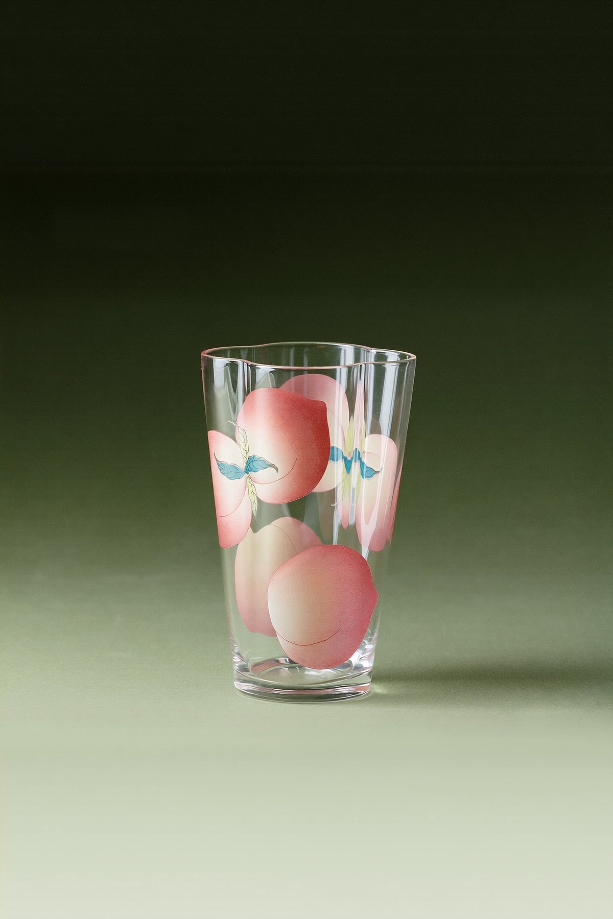 Spring Peach glass tumbler and cold brew bottle by TRLab Shop, featuring clear glass with peach-colored accents and a sleek design.
