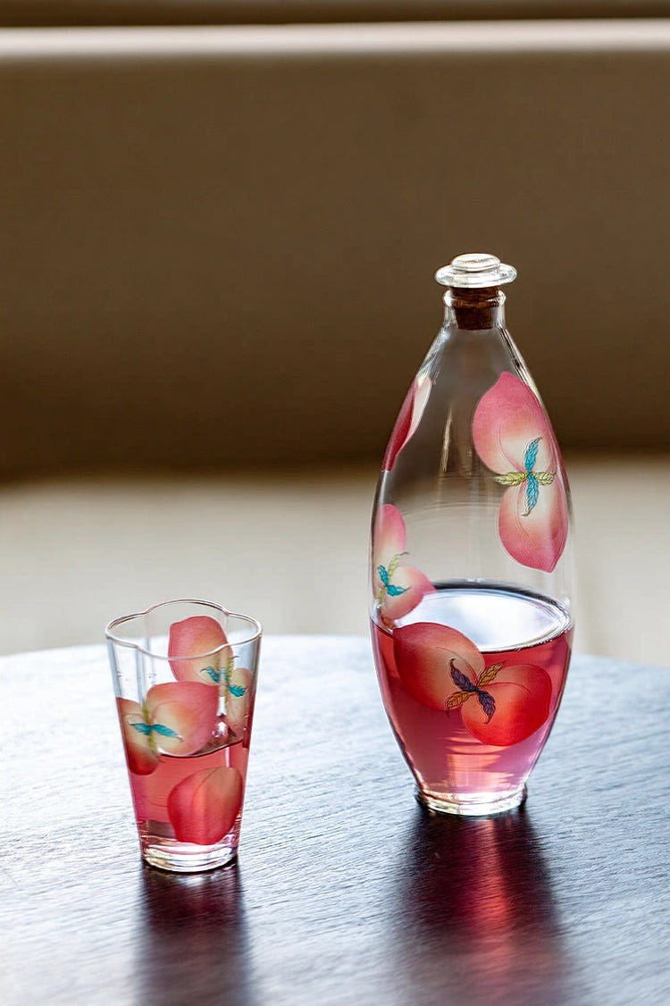 Spring Peach glass tumbler and cold brew bottle by TRLab Shop, featuring a sleek design and transparent peach-colored glass.