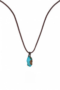 Turquoise hand-woven cord necklace with intricate design, showcasing vibrant color and artisan craftsmanship.