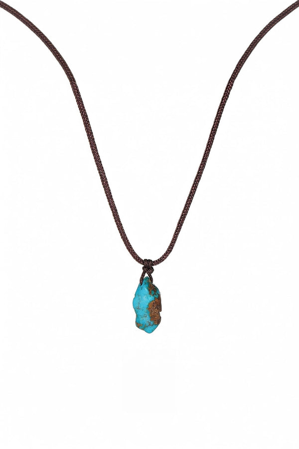 Turquoise hand-woven cord necklace with intricate design, showcasing vibrant color and artisan craftsmanship.