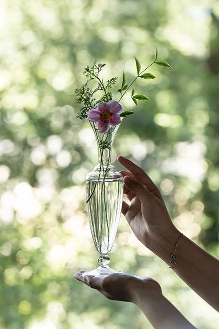 Elegant waisted glass vase by TRLab Shop with a clear, smooth surface, perfect for floral arrangements or decorative displays.