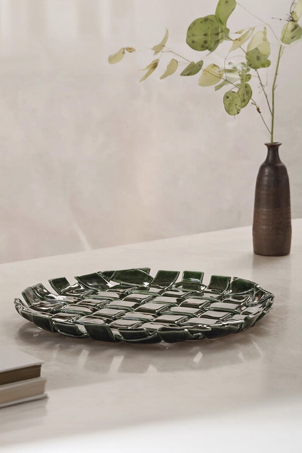Woven ceramic plate by TRLab Shop featuring intricate woven design and smooth glazed surface on a neutral background