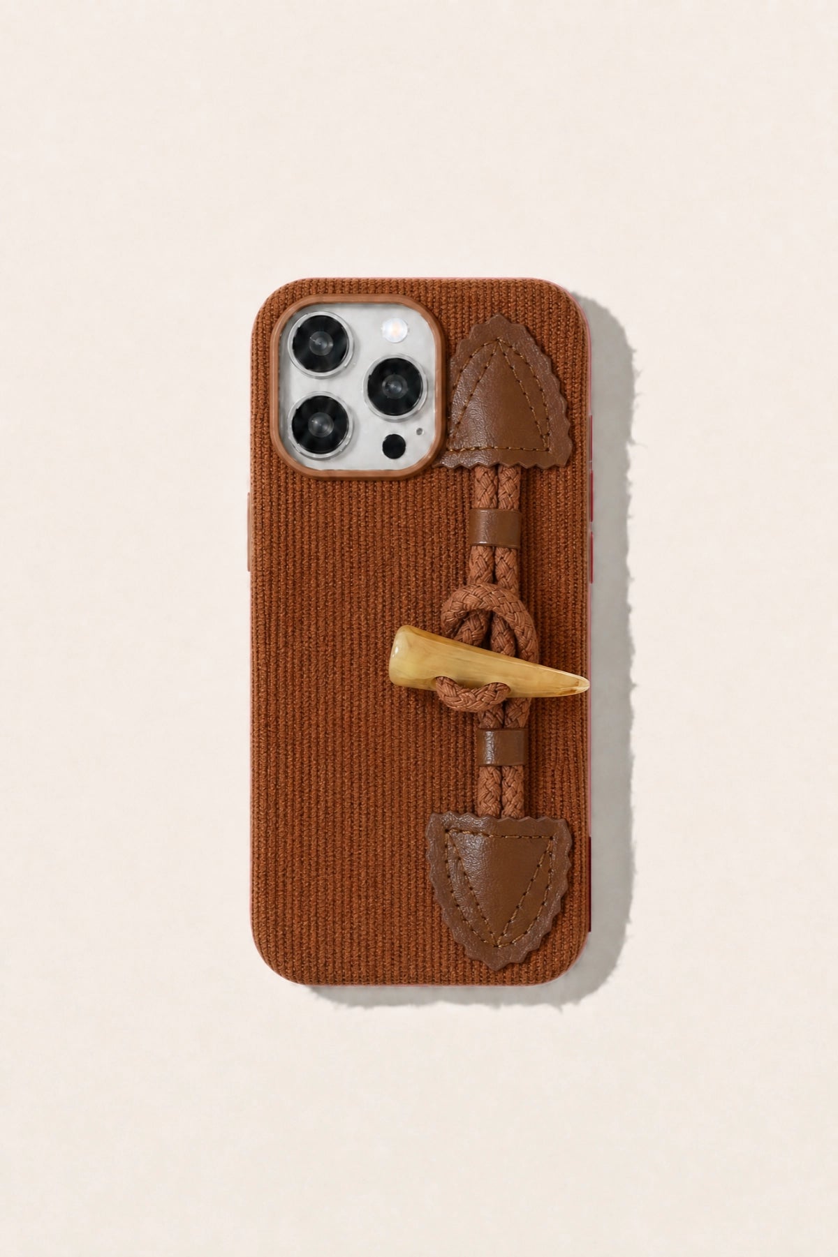 Striped corduroy fabric phone case with toggle button closure, showcasing a stylish TRLab Shop accessory.