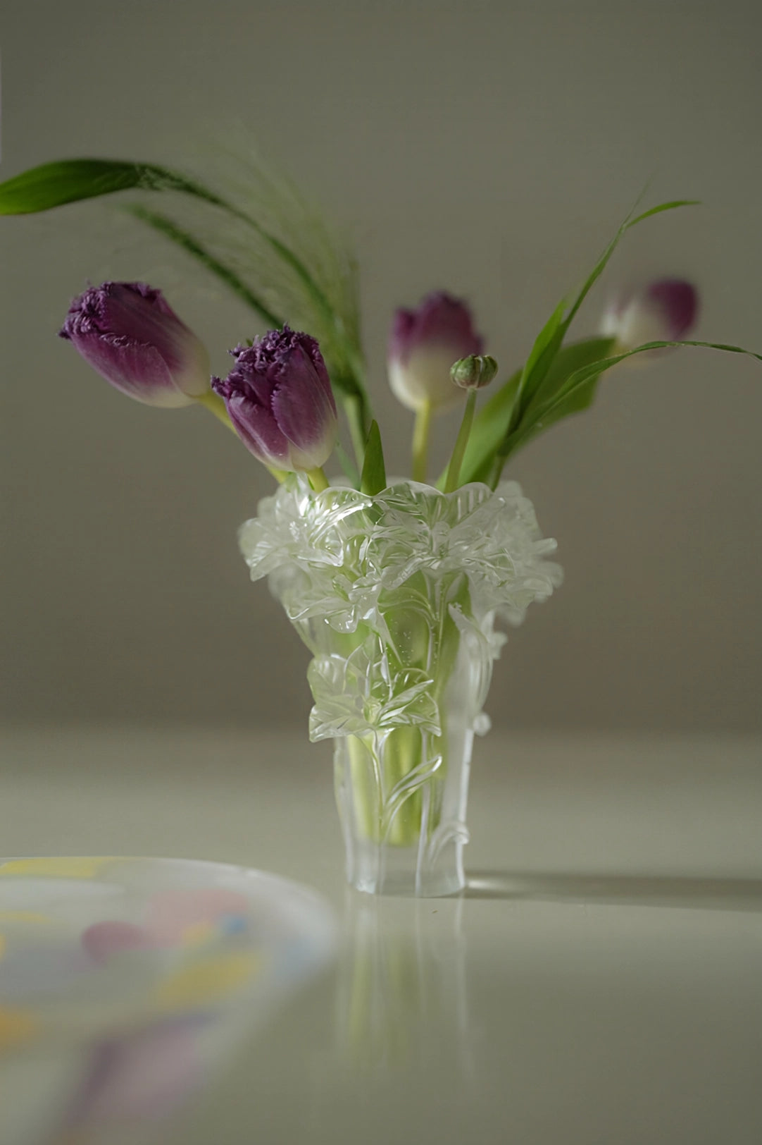 Elegant floral glass vase by TRLab Shop featuring a clear, decorative design perfect for displaying fresh or artificial flowers.