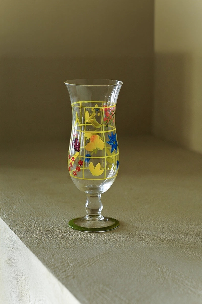 Hand-painted glass vase with colorful floral design, handcrafted by TRLab Shop, showcasing a vibrant decorative piece.