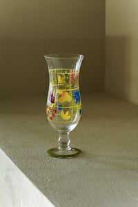 Hand-painted glass vase with colorful floral design, handcrafted by TRLab Shop, showcasing a vibrant decorative piece.
