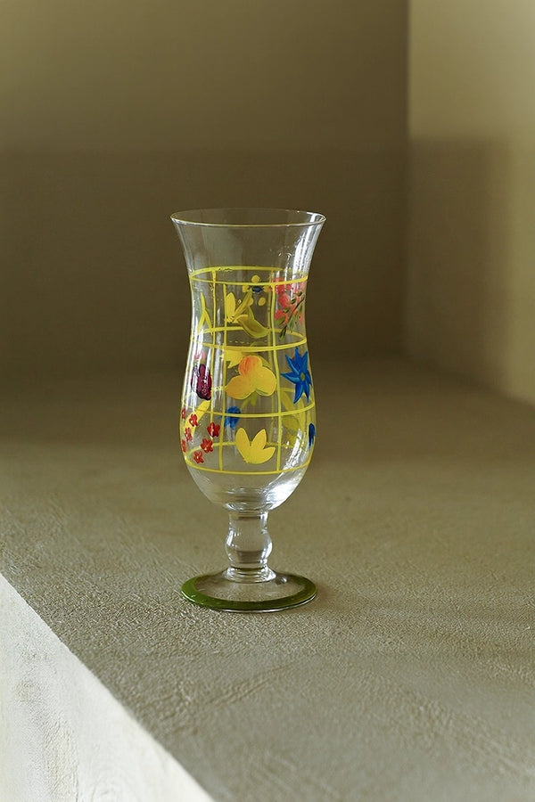 Hand-painted glass vase with colorful floral design, handcrafted by TRLab Shop, showcasing a vibrant decorative piece.