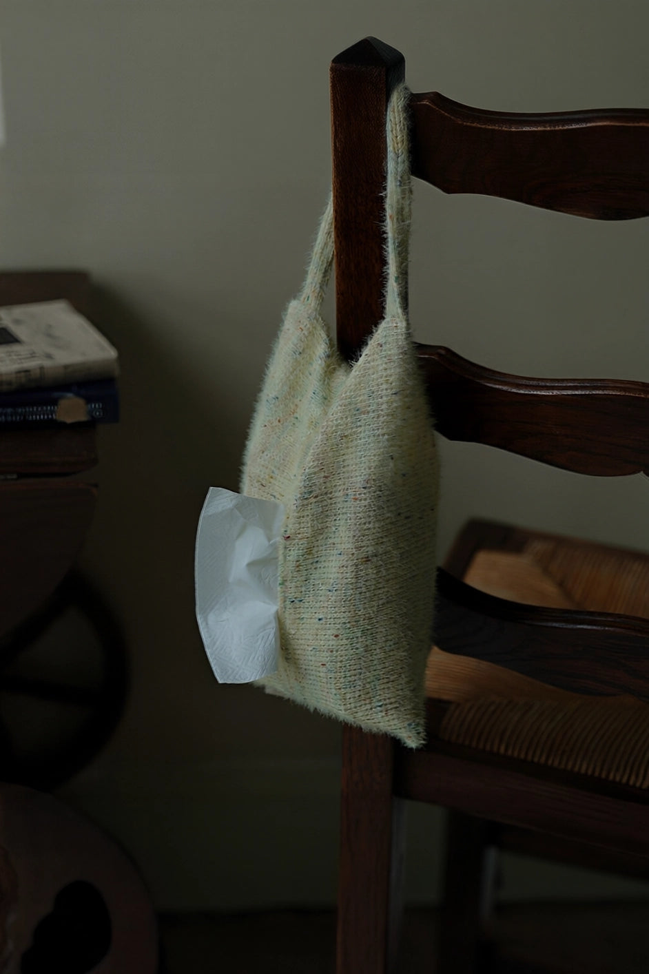 Knitted-handle tissue pack with soft tissues in a compact, stylish design, featuring a durable knitted handle for easy carrying.