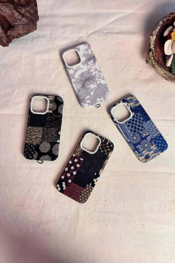 Tie-dyed fabric phone case by TRLab Shop featuring vibrant, swirling tie-dye pattern on a soft fabric cover for smartphones.