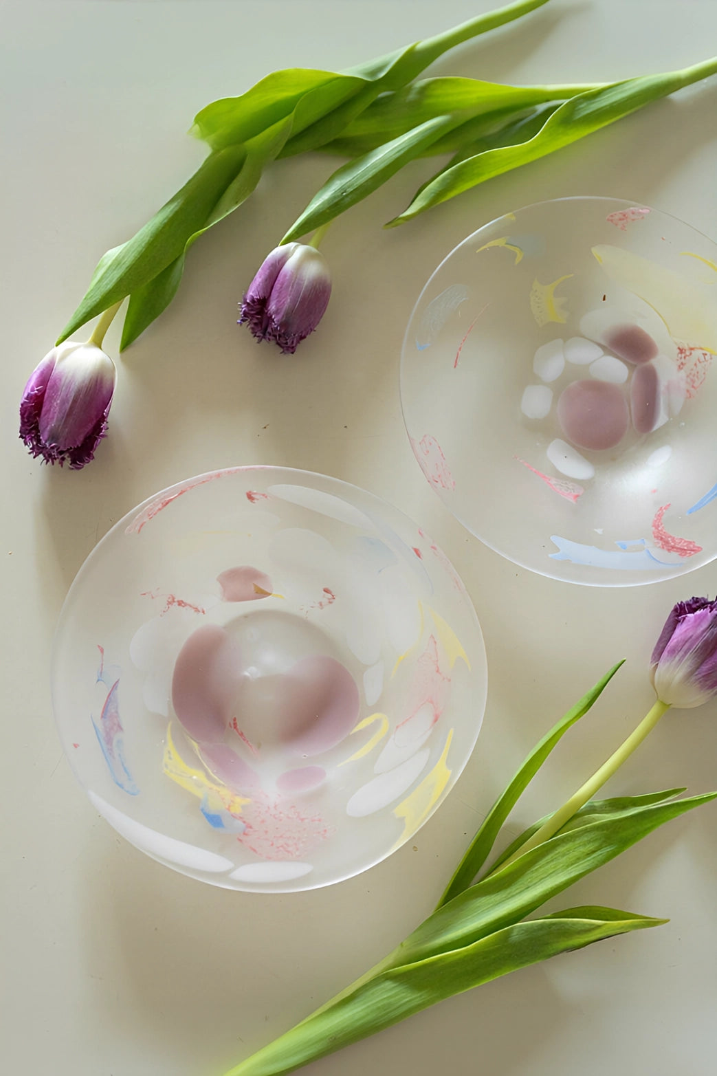 Luminous Fragment Glass Plate by TRLab Shop featuring colorful, glowing glass shards on a sleek surface.