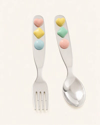 Jelly Jade stainless steel spoon and fork set for dinnerware, featuring smooth, shiny handles and polished metal surfaces.