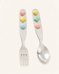Jelly Jade stainless steel spoon and fork set for dinnerware, featuring smooth, shiny handles and polished metal surfaces.