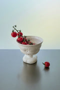 Ceramic goblet and footed pillow bowl from Yifan Renxu Studio, elegant dinnerware with unique design and smooth glazed finish.
