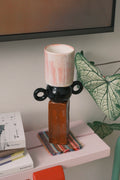 Ceramic multi-geometric vase by UNBELDI featuring a modern design with colorful geometric patterns on a white background.