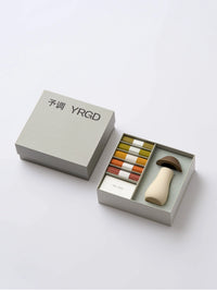 White incense mushroom holder from YRGD, colorful short incense sticks in a decorative gift box, ideal for aromatic home decor.