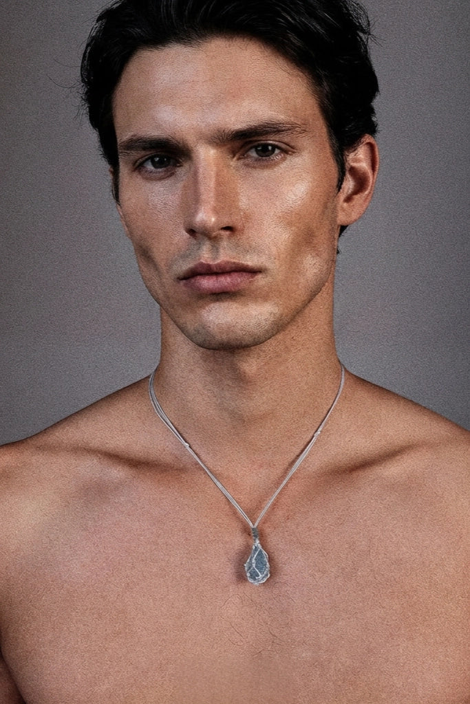 Aquamarine hand-woven cord necklace featuring a vibrant aquamarine pendant on a natural fiber cord.