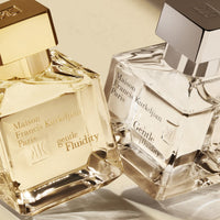 Bottle of Gentle Fluidity Silver perfume by Maison Francis Kurkdjian with elegant packaging and clear glass design.
