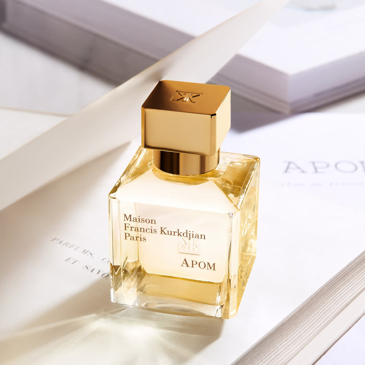 Maison Francis Kurkdjian Apom perfume bottle with elegant packaging, showcasing a luxurious and sophisticated fragrance presentation.