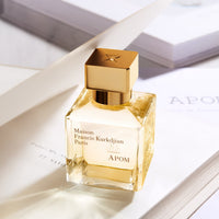 Maison Francis Kurkdjian Apom perfume bottle with elegant packaging, showcasing a luxurious and sophisticated fragrance presentation.