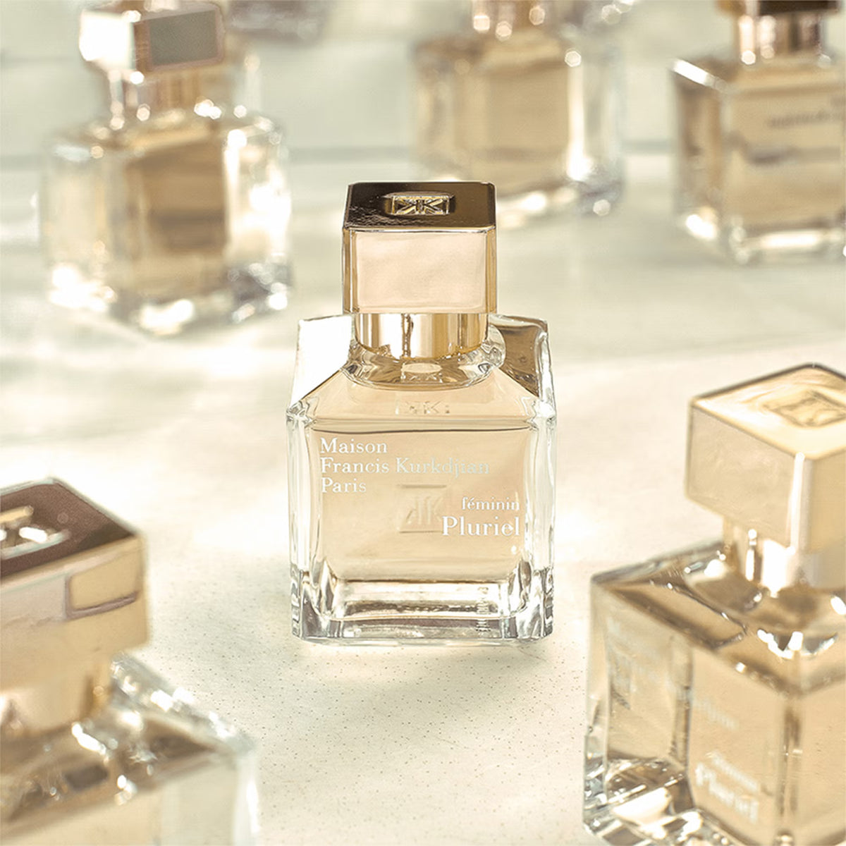 Maison Francis Kurkdjian Féminin Pluriel 2.4 EDP perfume bottle, elegant design, displayed on a neutral background.