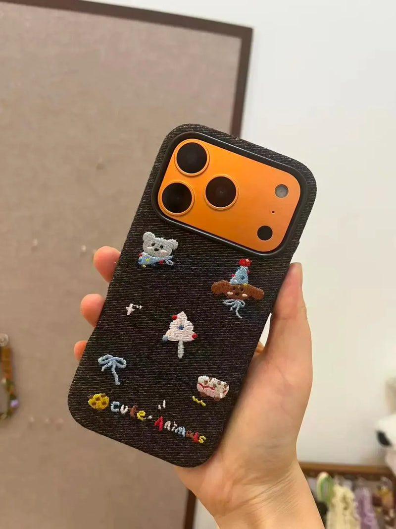 Embroidered TRLab Shop beach-themed MagSafe phone case with colorful floral embroidery on a protective case for iPhone.