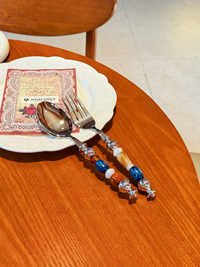Multicolor bead cutlery set by TRLab Shop featuring stylish, colorful utensils for festive table settings.