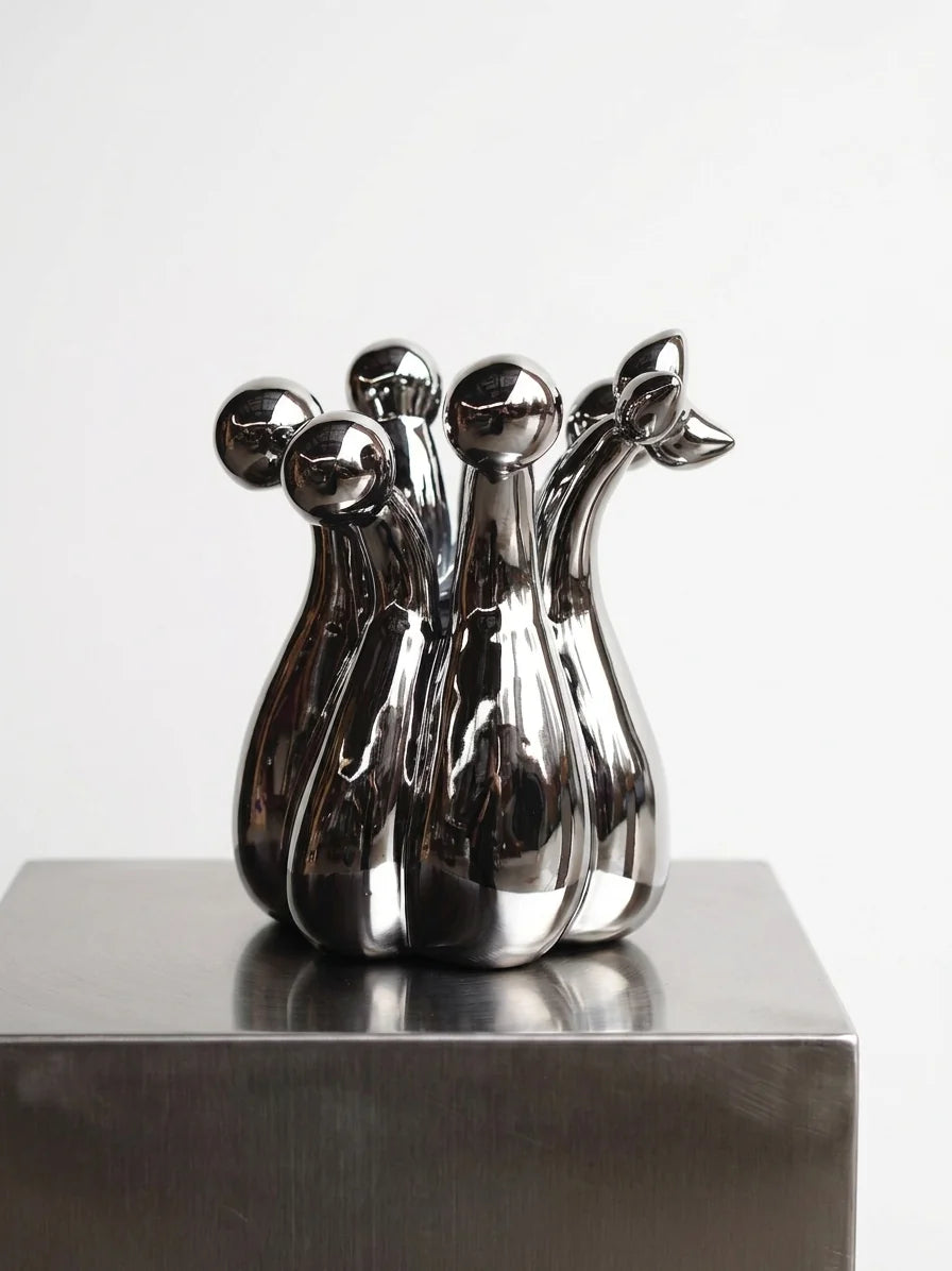 TAOTAO STUDIO Crown of Mud ribbed gourd vase in mirror chrome finish, modern home decor piece with textured surface.
