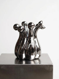 TAOTAO STUDIO Crown of Mud ribbed gourd vase in mirror chrome finish, modern home decor piece with textured surface.